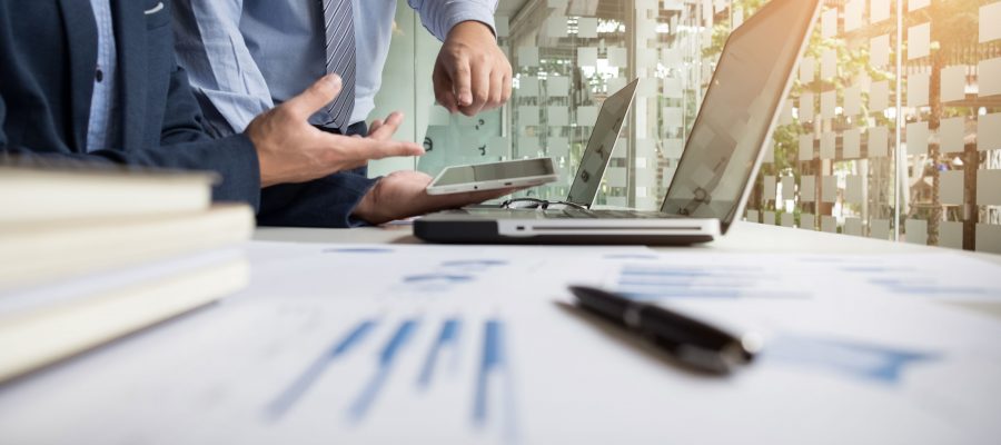 Business adviser analyzing financial figures denoting the progress in the work of the company.